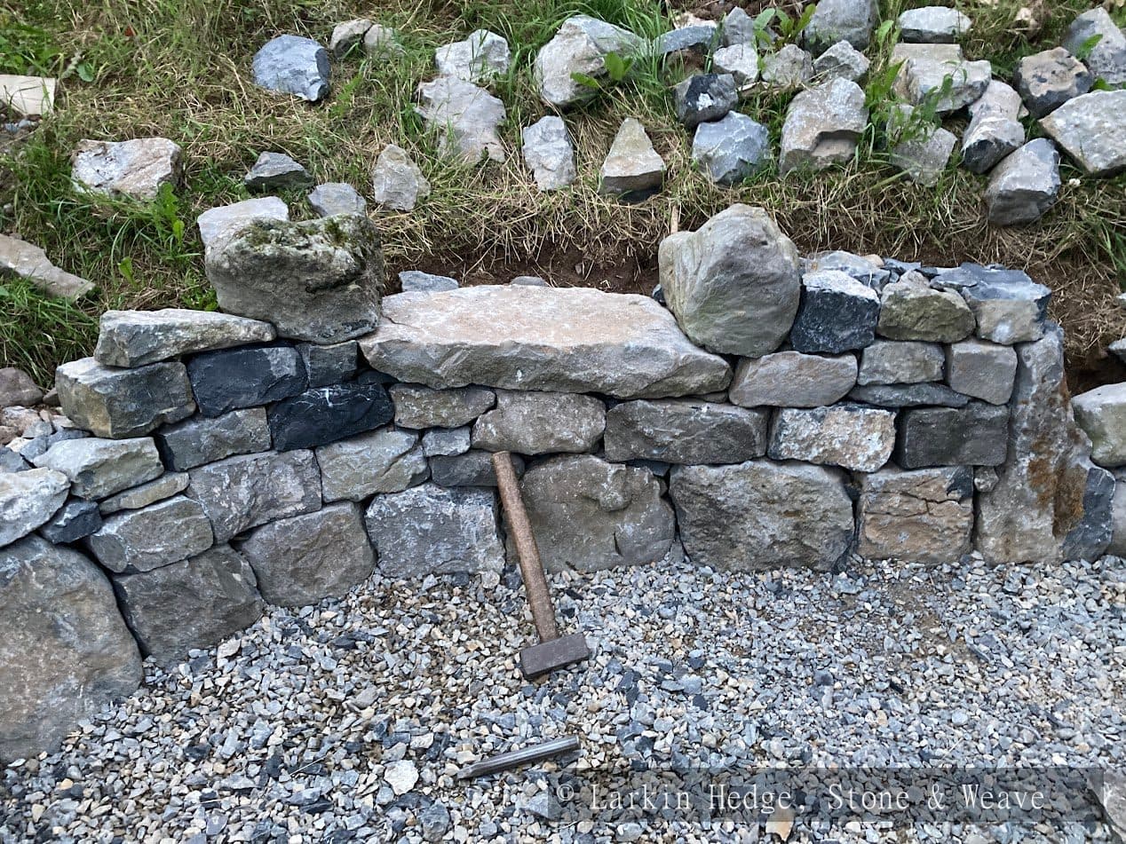 Garden retaining wall with built-in seat